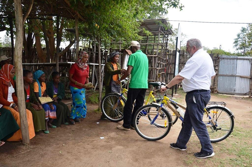 ChildFund Ethiopia Country Director Chege Ngugi and ChildFund Ireland CEO Michael Kiely presenting Dream Bikes